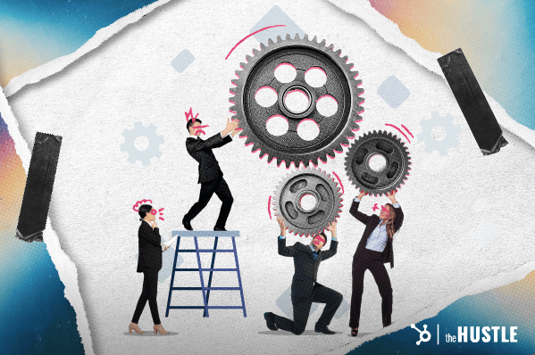 Product development vs. product management: Four workers put machine cogs together.