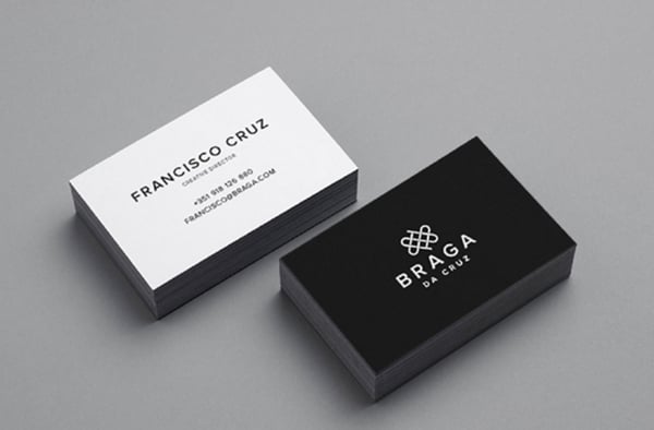 braga da cruz minimalist design on business cards with monochrome palette, sans serif font, and simple line logo