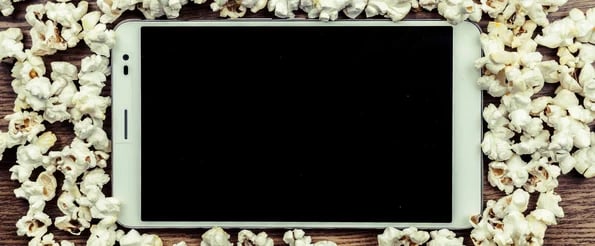 visual history of content marketing: image shows tablet surrounded by popcorn