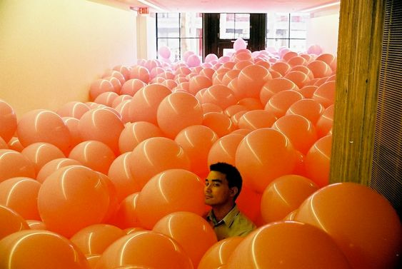 office prank:  ballon filled conference room 