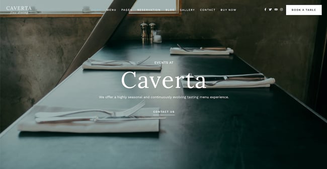 restaurant wordpress themes: Caverta demo features full-body background image overlaid with white minimalist text