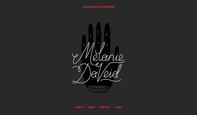 black and white website: Melanie DaVeid's portfolio uses black and white color scheme with bright red accent color
