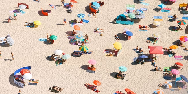 People chilling out under umbrellas in a beach