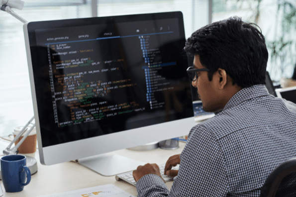 Developer coding with JavaScript framework