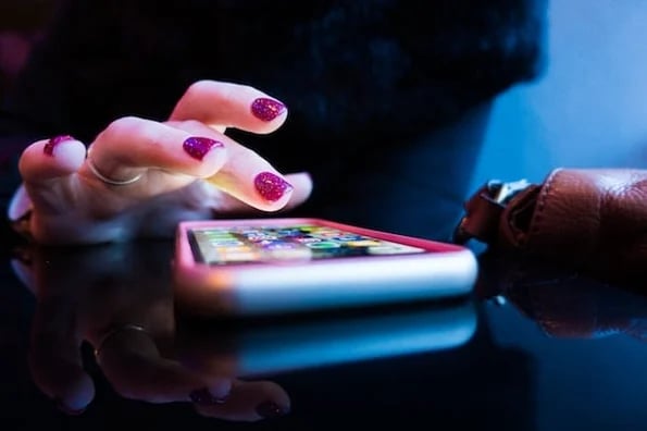 hand on smartphone using a progressive web app