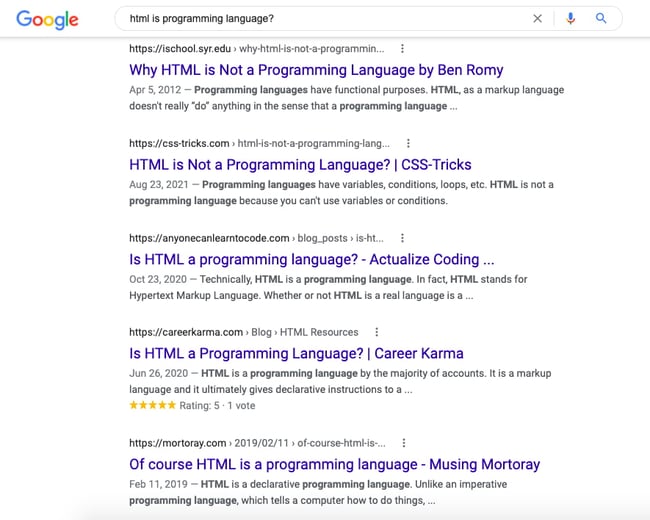 SERP showing articles with headlines saying HTML is not a programming language and that HTML is