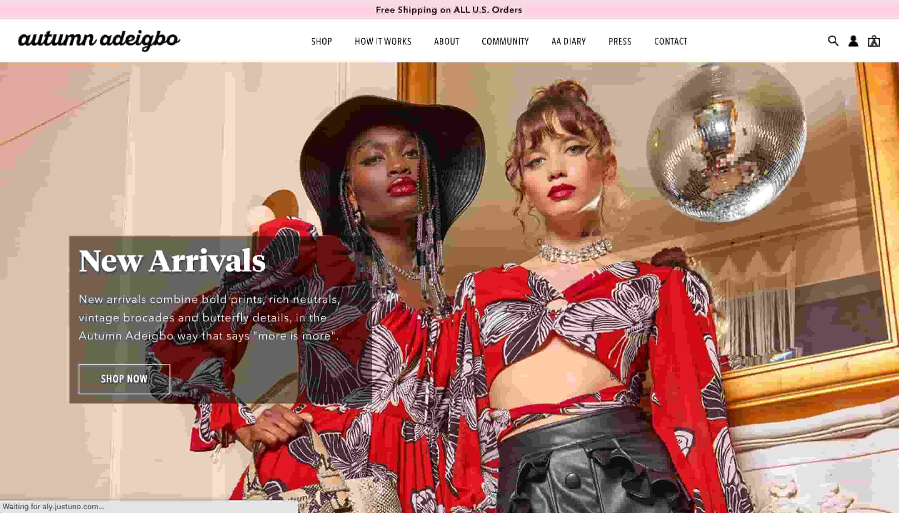 fashion website design Autumn Adeigbo shows two models wearing red outfits with a disco ball in the background 