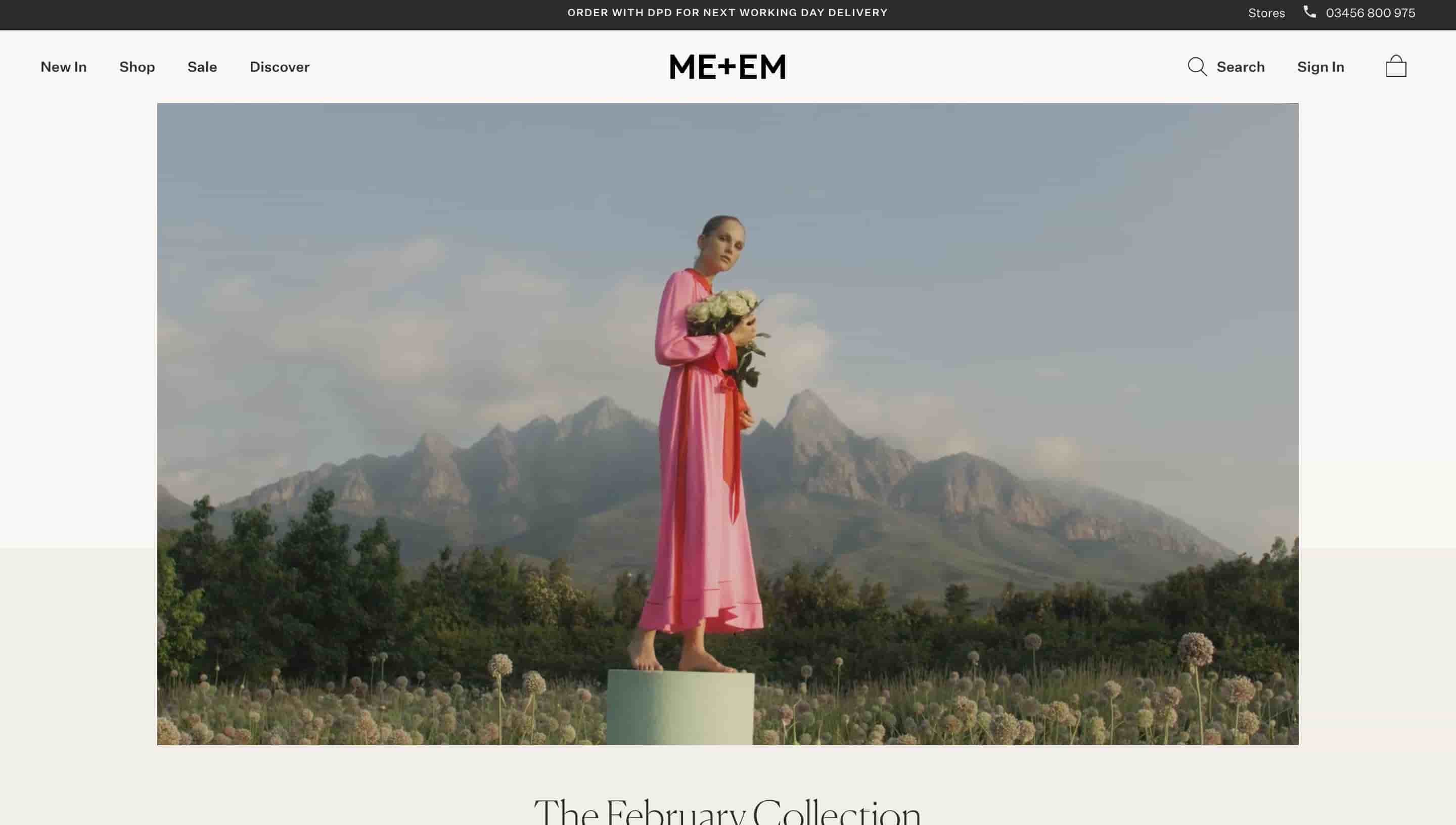 fashion website design me + em shows person wearing dress standing on a platform with flowers and mountains in the background