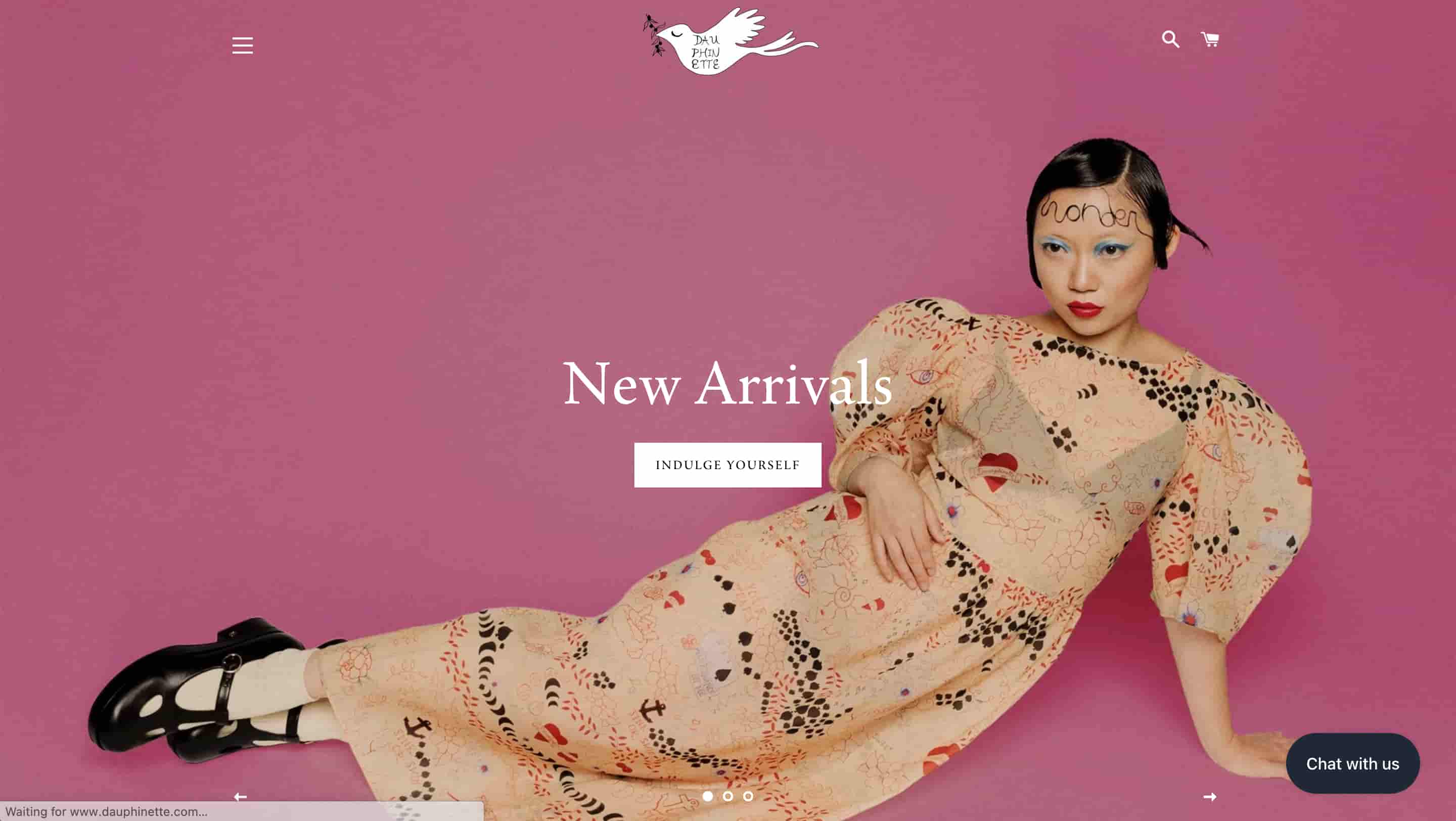 fashion website design dauphinette shows person wearing the brand's clothing laying on a pink background 