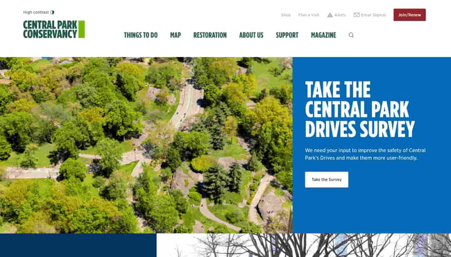 best natural websites: central park conservancy homepage invites visitors to take the central park drives survey accompanied by an image of trees and a road which cuts through the park 