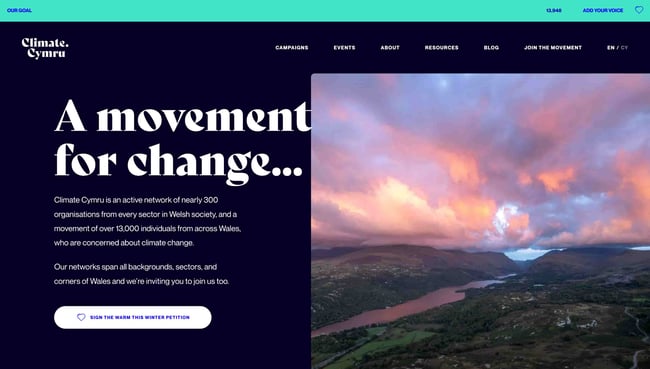 best natural websites climate cymru homepage says "a movement for change" and shows a beautiful valley with a colorful sunset over it 