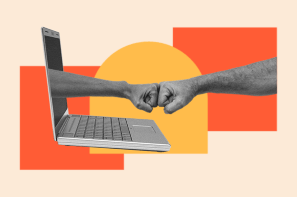 Someone fist bumps a hand coming out of a laptop; representing creators and marketers teaming up with AI.
