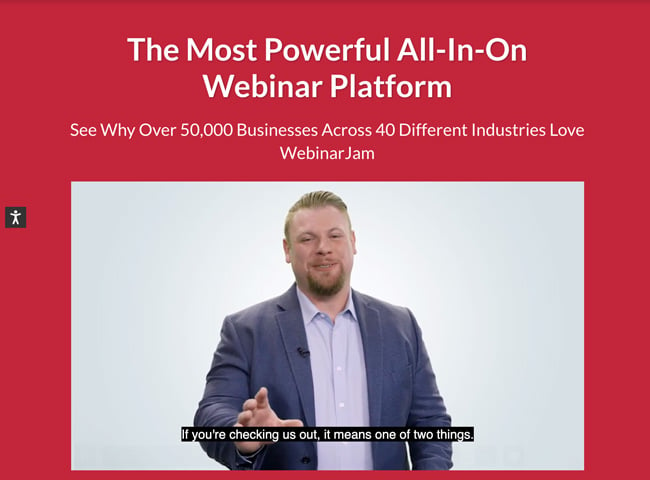 WebinarJam Website homepage that has a bright red background and shows a man hosting a webinar. Text says The most powerful all-in-on webinar platform
