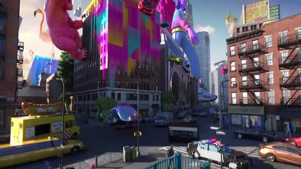 Screenshot of Adobe TV ad with a 3D-rendered city that's being drenched in Adobe's signature colors