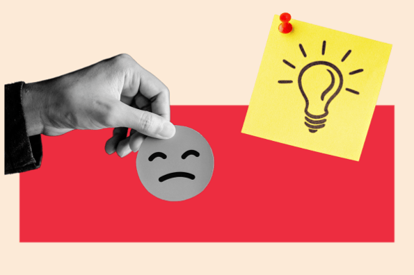 ai challenges represented by a hand holding a sad face and a lightbulb for sparking new ideas