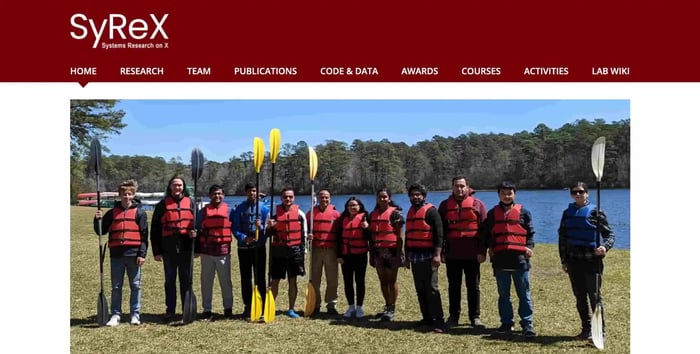 systems research x homepage, showing the team doing a canoe activity