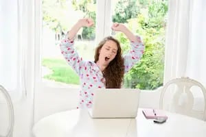 best blogs from 'boring' industries: image shows woman yawning at laptop