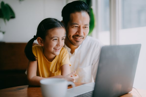Father and daughter playing best coding games together
