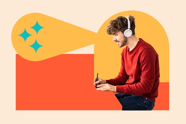 Brand Style Guide Examples: Person on laptop with earbuds on looking into brand style guides. 