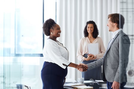 business women shaking hands with prospect