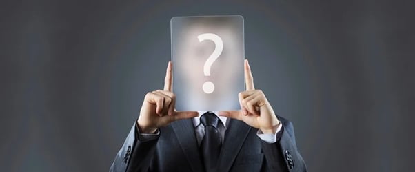 decision maker buyer persona: image shows person holding up a question mark in front of face 