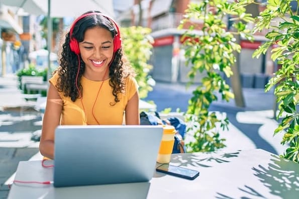 Woman participates in community forum on her laptop