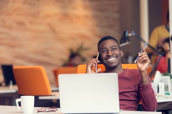 ultimate guide to company culture man smiling while on the phone
