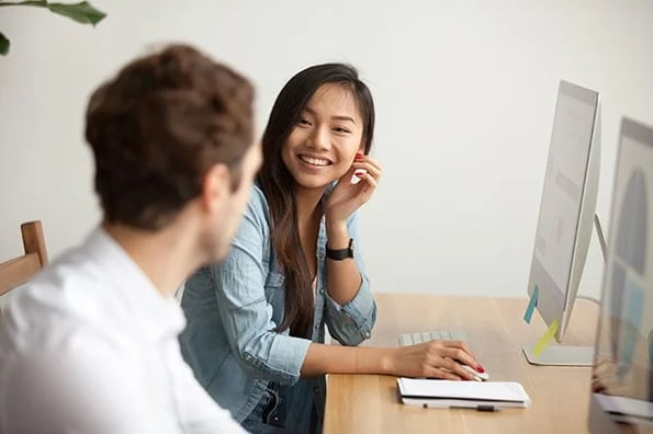 Coworkers discussing content marketing tools