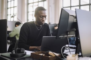 person using the css position property on a computer in an office