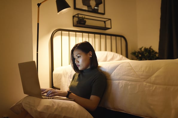 person learning about css specificity on a laptop in her bedroom
