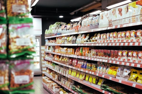 Grocery store aisle that demonstrates economy pricing of food items.