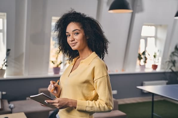 entrepreneur takes notes while completing an educational course