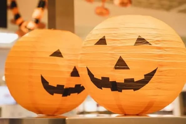 halloween costumes for marketers: image shows two paper lanterns that look like pumpkins
