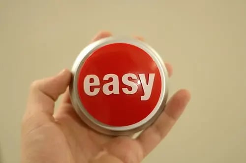 hand holding easy button