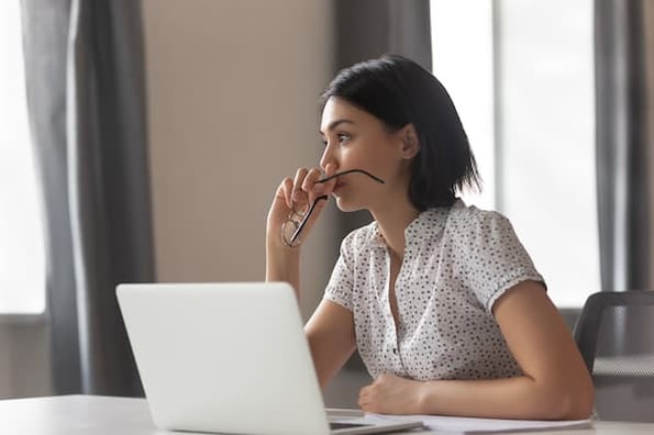 woman considers buying bitcoin on a cryptocurrency exchange