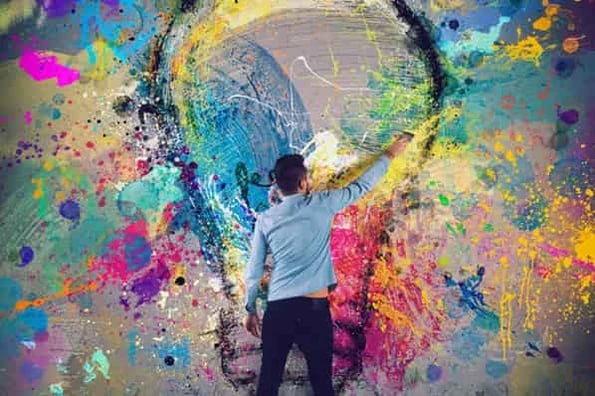 how to stay creative under pressure: image shows person painting a mural