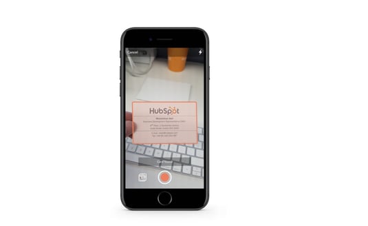 Screenshot of Hubspot's business card scanner, available on the HubSpot app; What is AI?