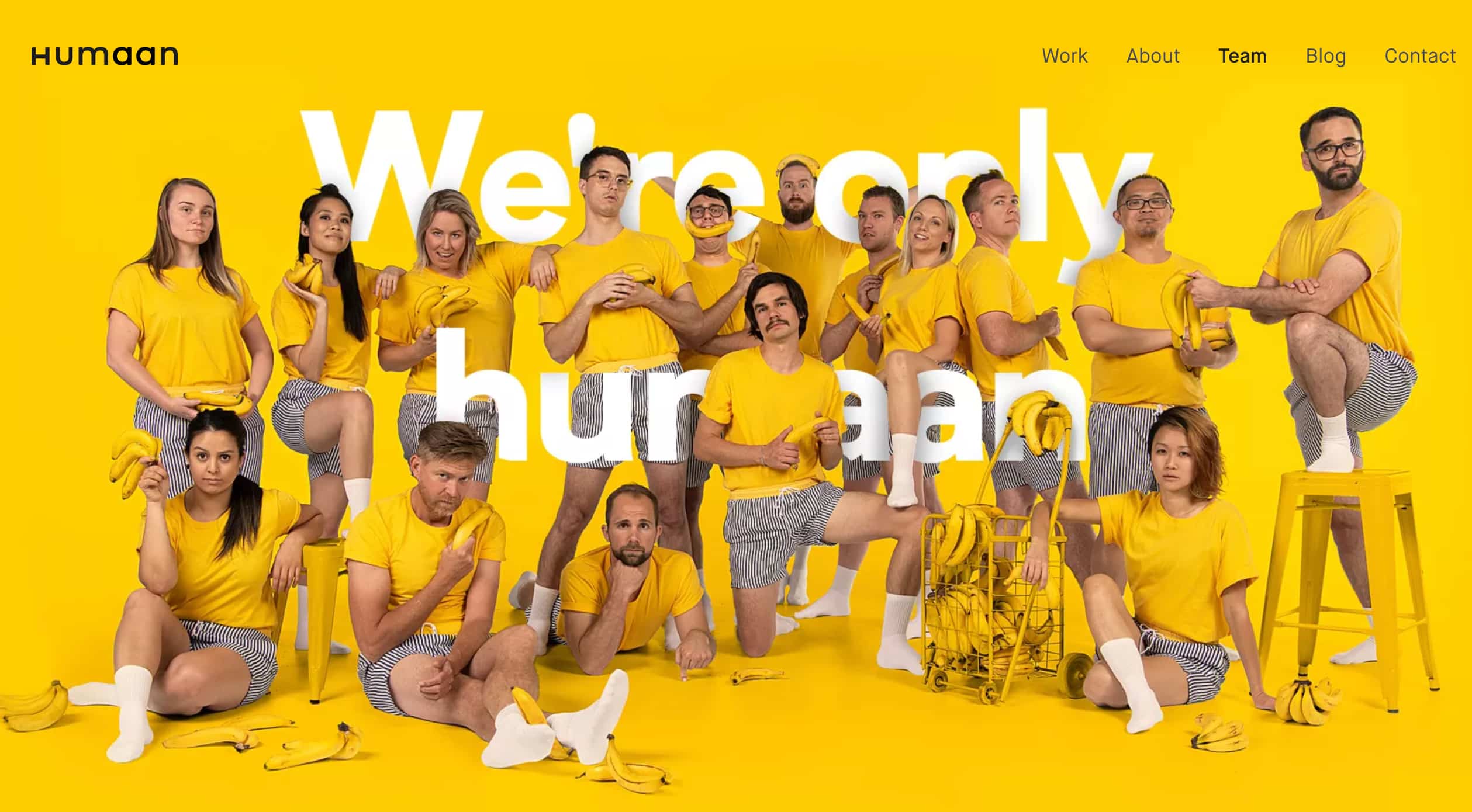 Meet the team page example from Humaan. Group photo of the team wearing matching outfits with bananas everywhere.