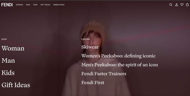Luxury websites: Fendi. Website features a video of a model wearing Fendi clothes and makes the menu the focus. 