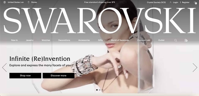 Luxury Websites: Swarovski. Features a video of a model wearing the brand's items, and massive font with the brand name. 