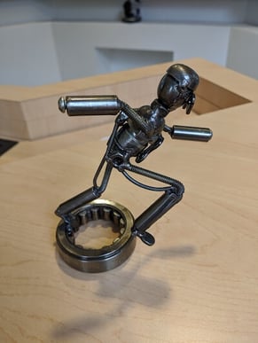 Metal figurine with shadow taken on phone with no flash