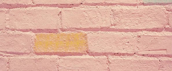 native advertising: image shows pink and yellow brick wall