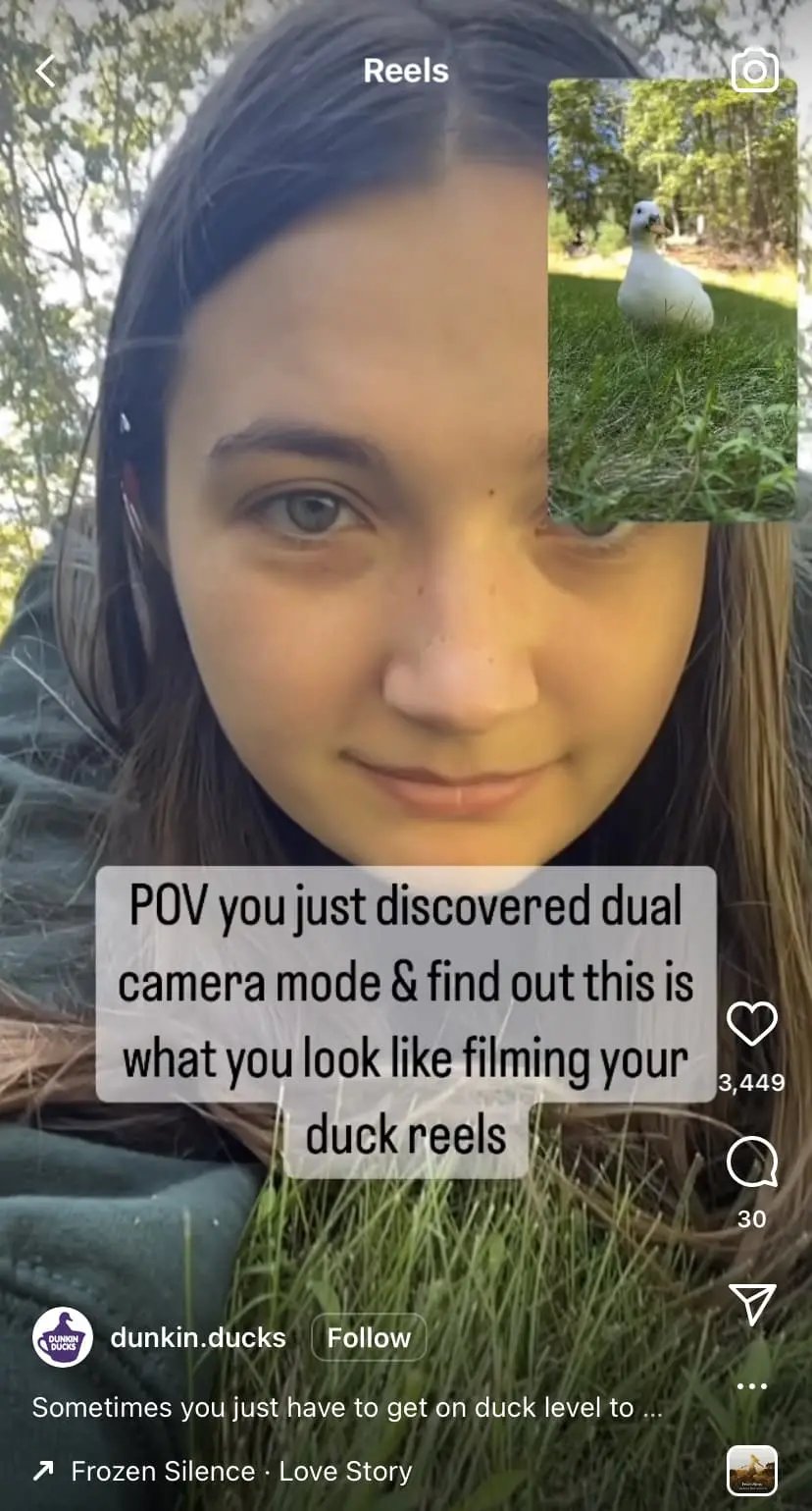Girl uses dual camera feature to film baby duck