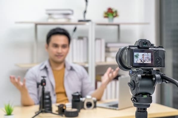 A marketer films a product demo video for her brand