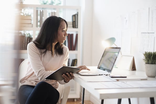 Woman with flexible work schedule on her laptop at home.