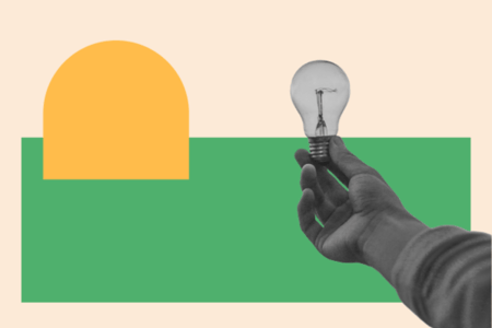qualitative research methods, hand holding a lightbulb to signify qualitative research insights