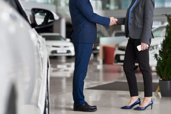 a business man shaking hands with a customer for strategic relationship marketing