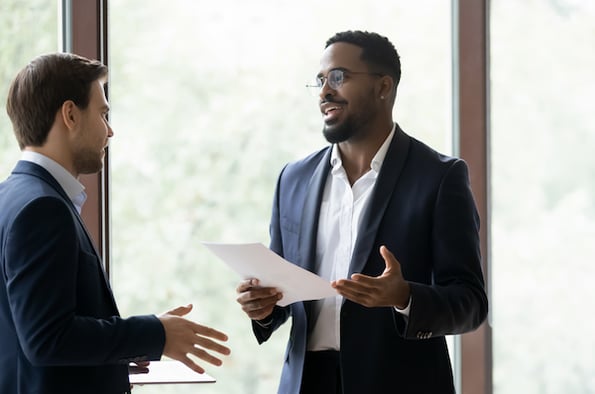 salespeople discussing pricing trends