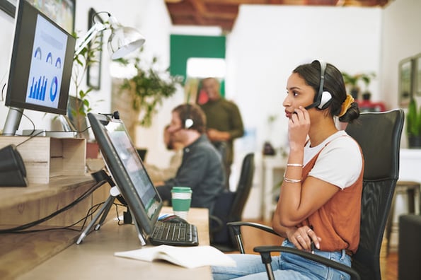 A sales agent uses sales tech during a phone call