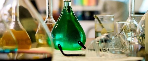 science-based hacks to improve decision-making: image shows lab with beakers 